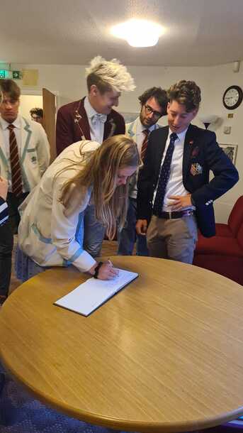 Queen's Prize winner signing Ibis visitors book